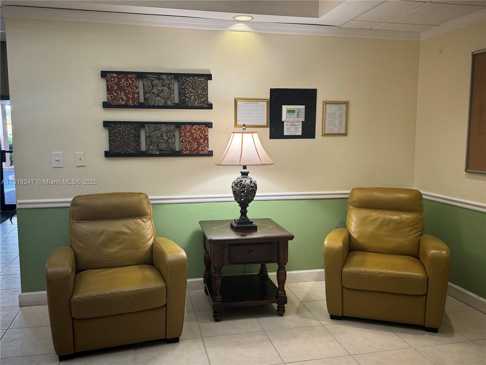 1100 St Charles Place, Unit 203 Pembroke Pines, FL 33026 - Photo 37 of 48 a living room with furniture and a mirror