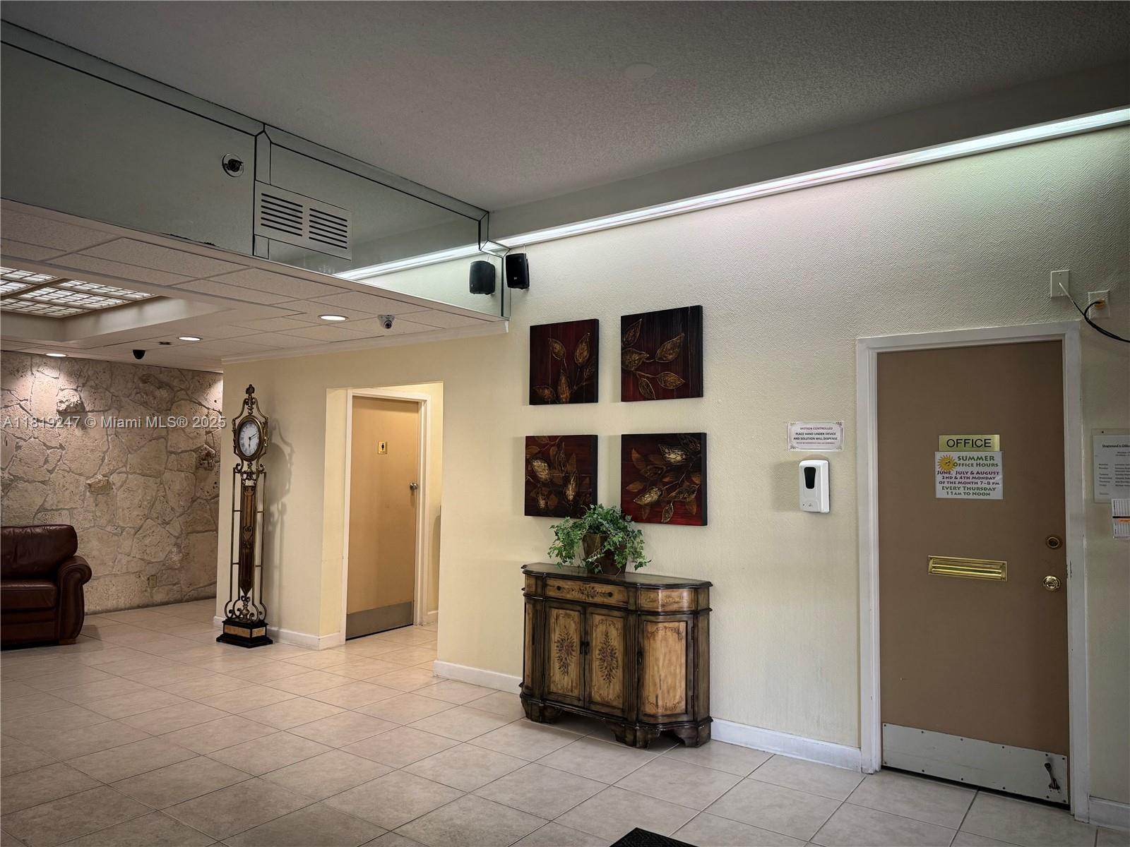 1100 St Charles Place, Unit 203 Pembroke Pines, FL 33026 - Photo 40 of 48 a view of a entryway door with living room