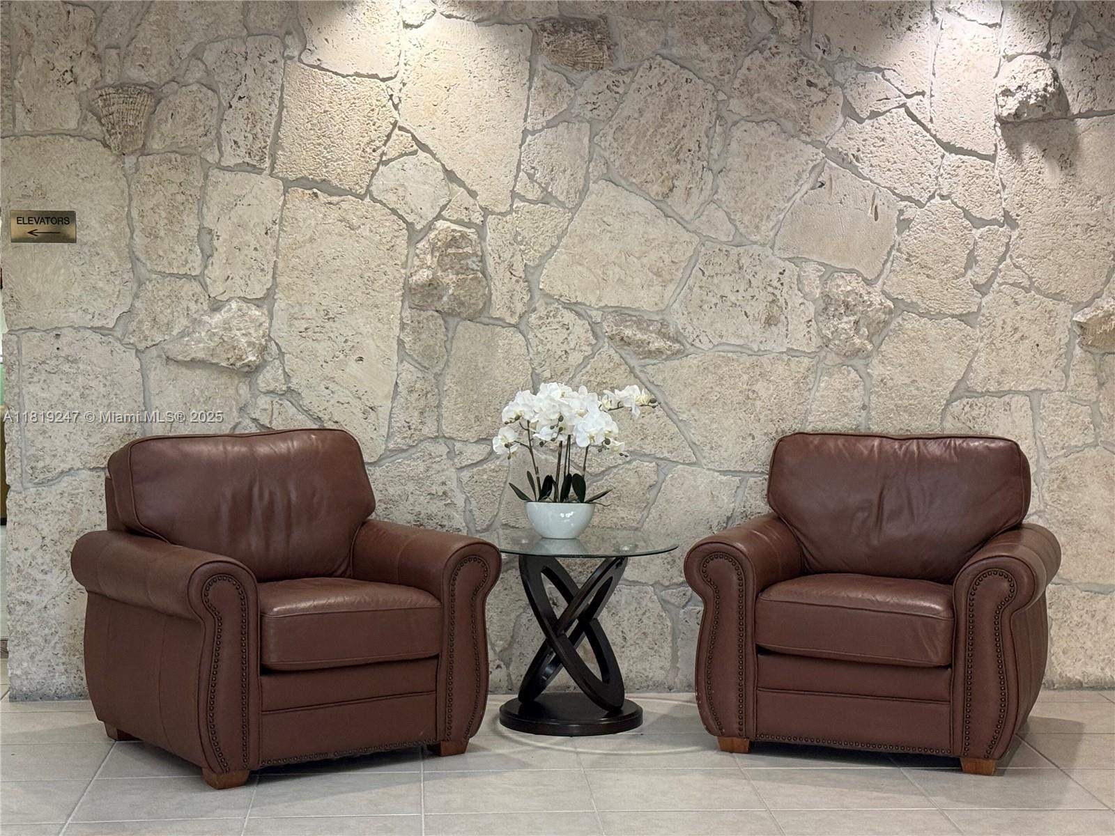 1100 St Charles Place, Unit 203 Pembroke Pines, FL 33026 - Photo 41 of 48 a living room with furniture and a couch