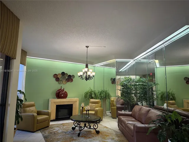 a front view of a house with a palm tree