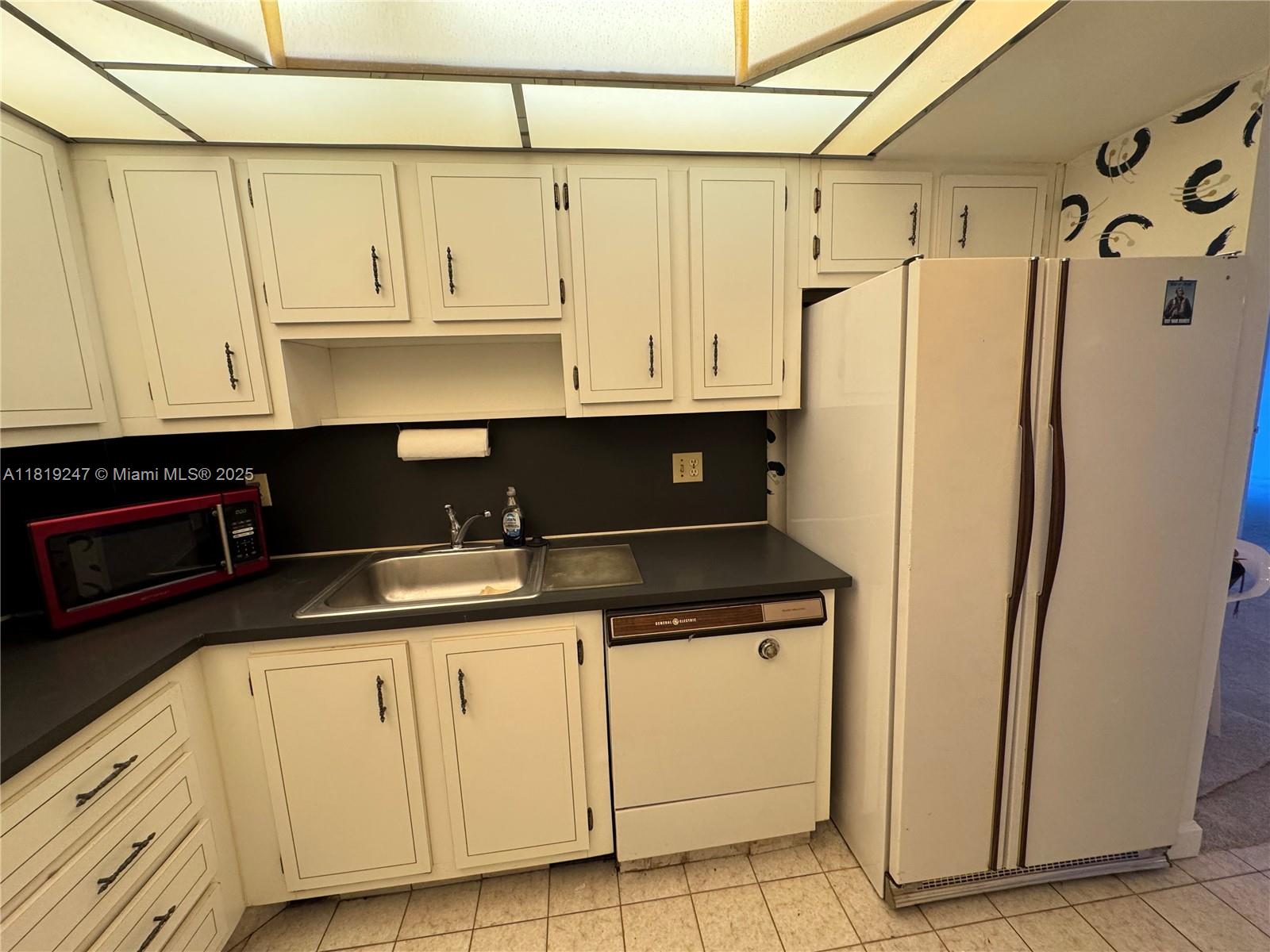 1100 St Charles Place, Unit 203 Pembroke Pines, FL 33026 - Photo 8 of 48 a view of a refrigerator and window