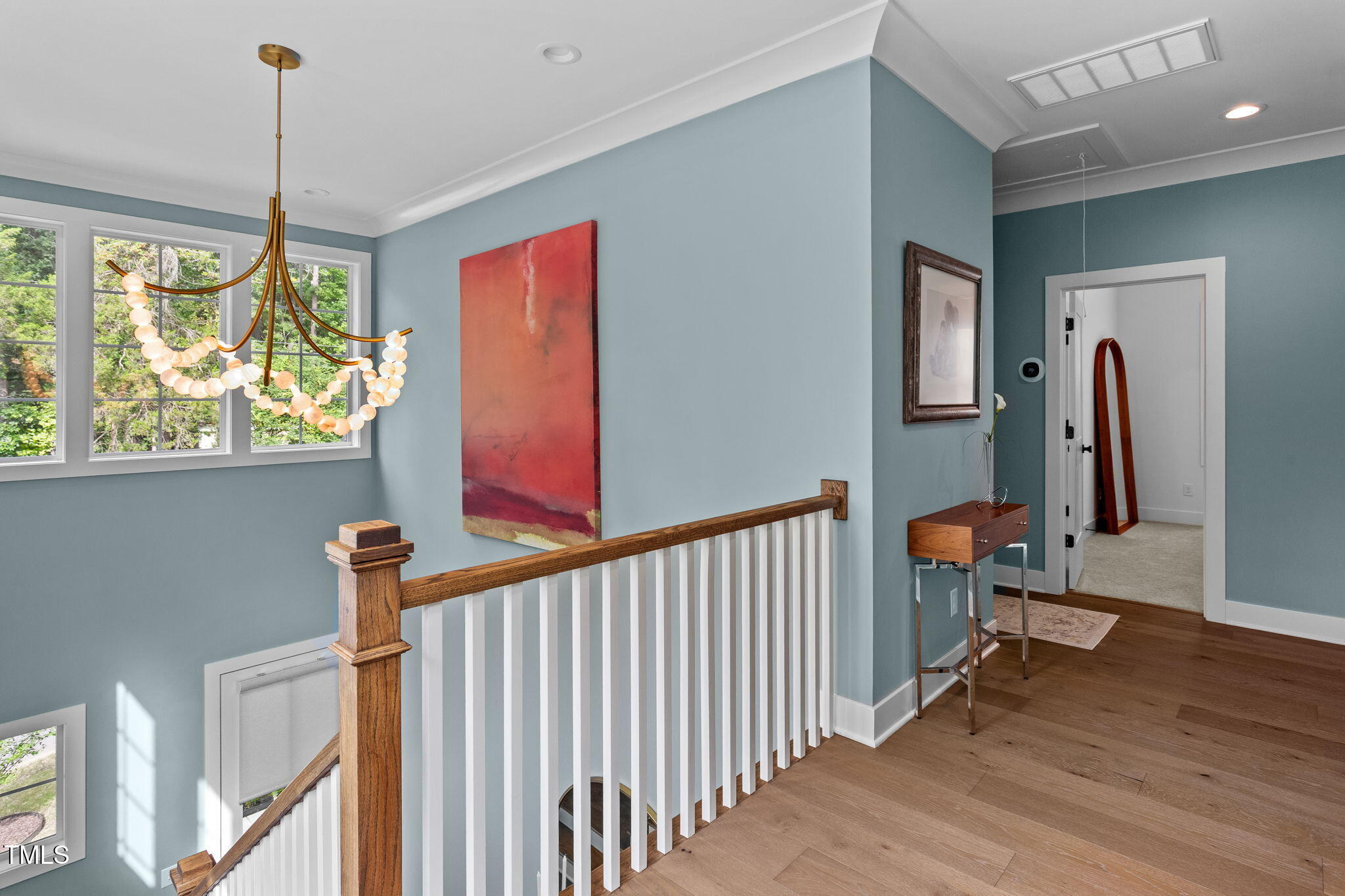 6502 Brecken Pines Raleigh, NC 27612 - Photo 15 of 42 a view of a hallway with workspace and windows