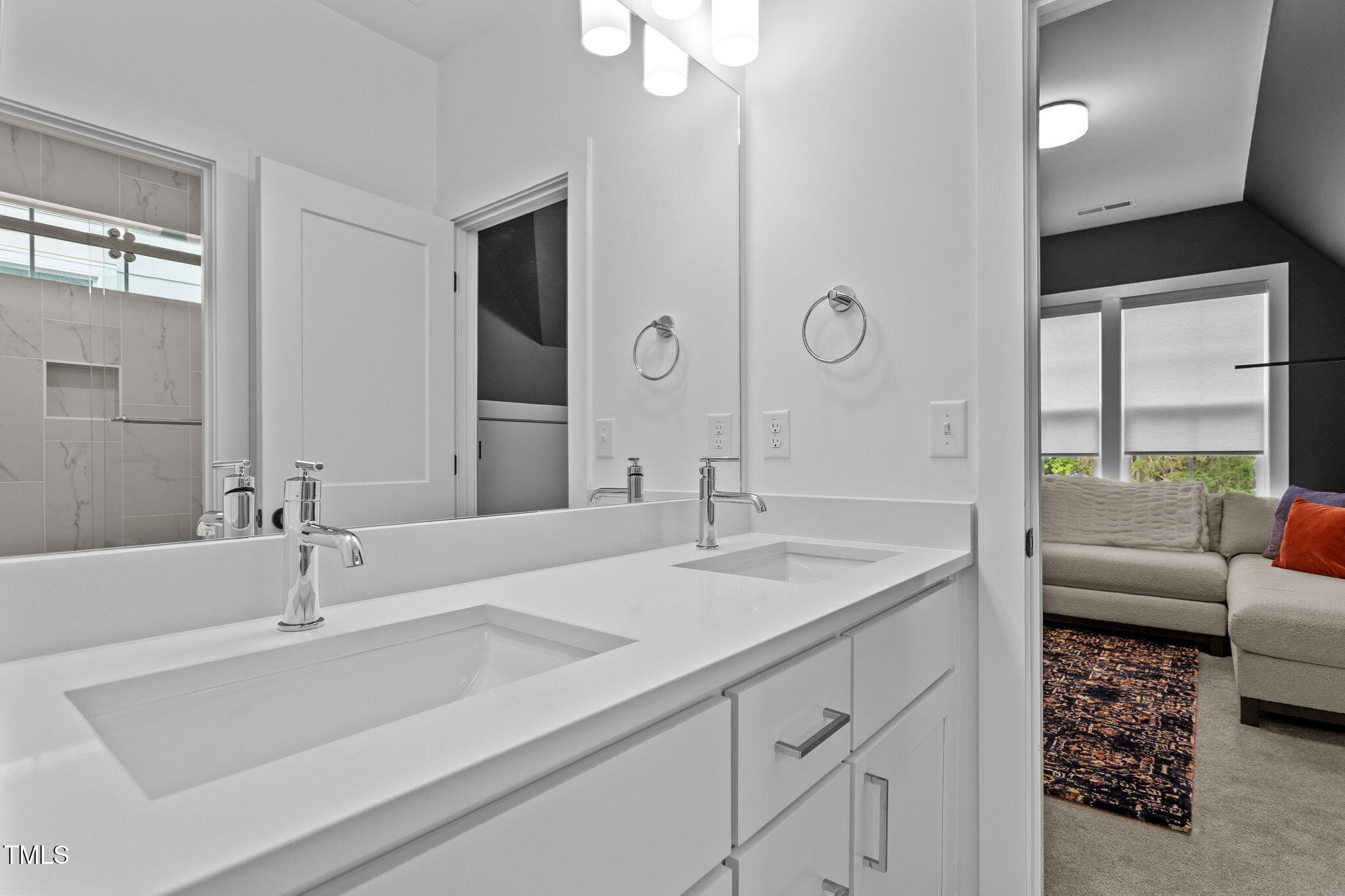 6502 Brecken Pines Raleigh, NC 27612 - Photo 23 of 42 a en suite bathroom with double sink and a mirror
