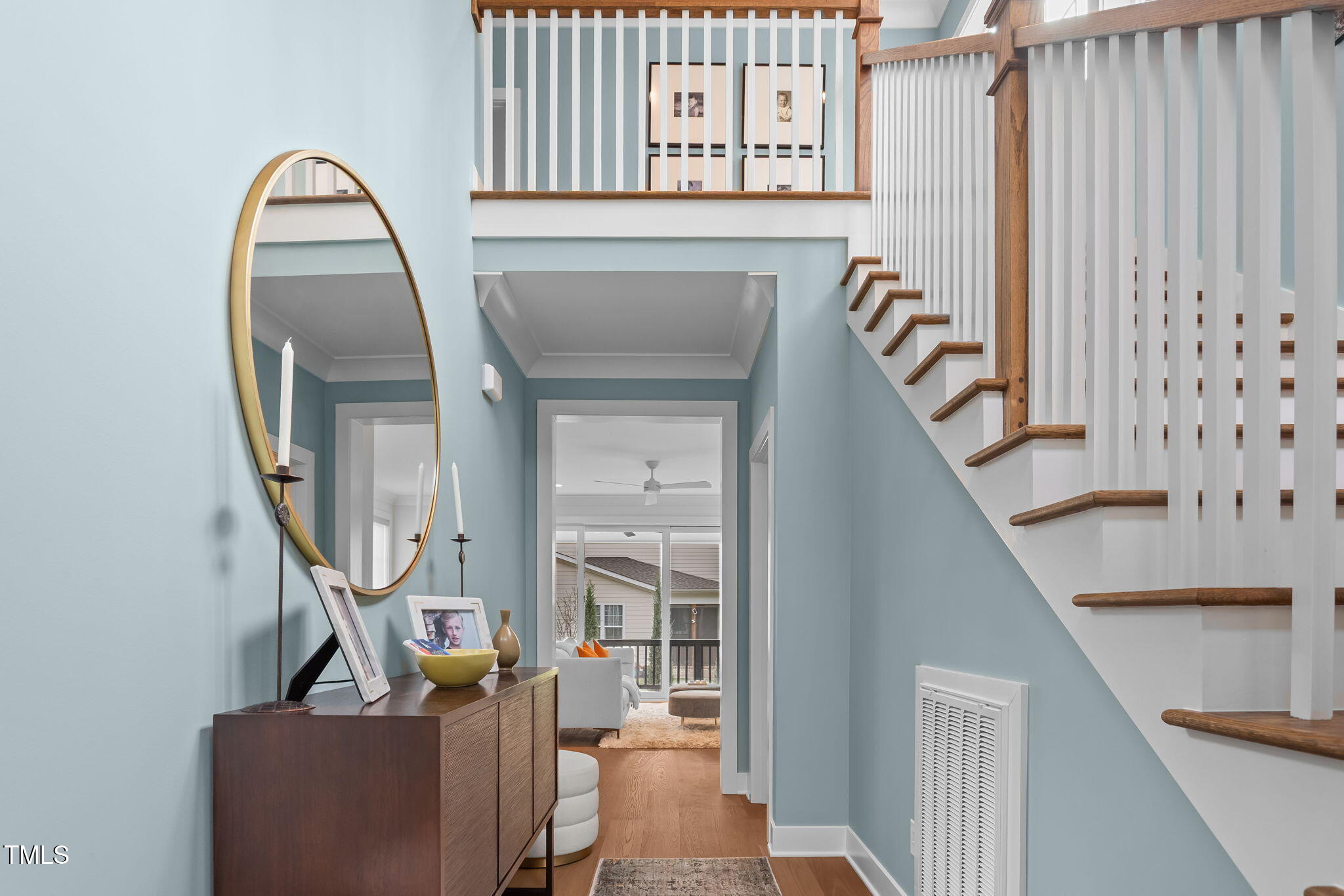 6502 Brecken Pines Raleigh, NC 27612 - Photo 4 of 42 a view of staircase with furniture and a window