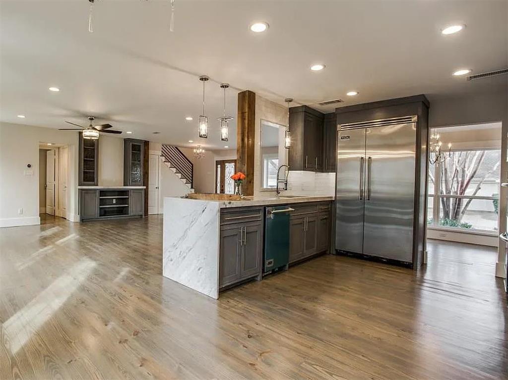 4310 Forest Bend Road Dallas, TX 75244 - Photo 14 of 34 a kitchen with stainless steel appliances a refrigerator a sink dishwasher with a oven and cabinets
