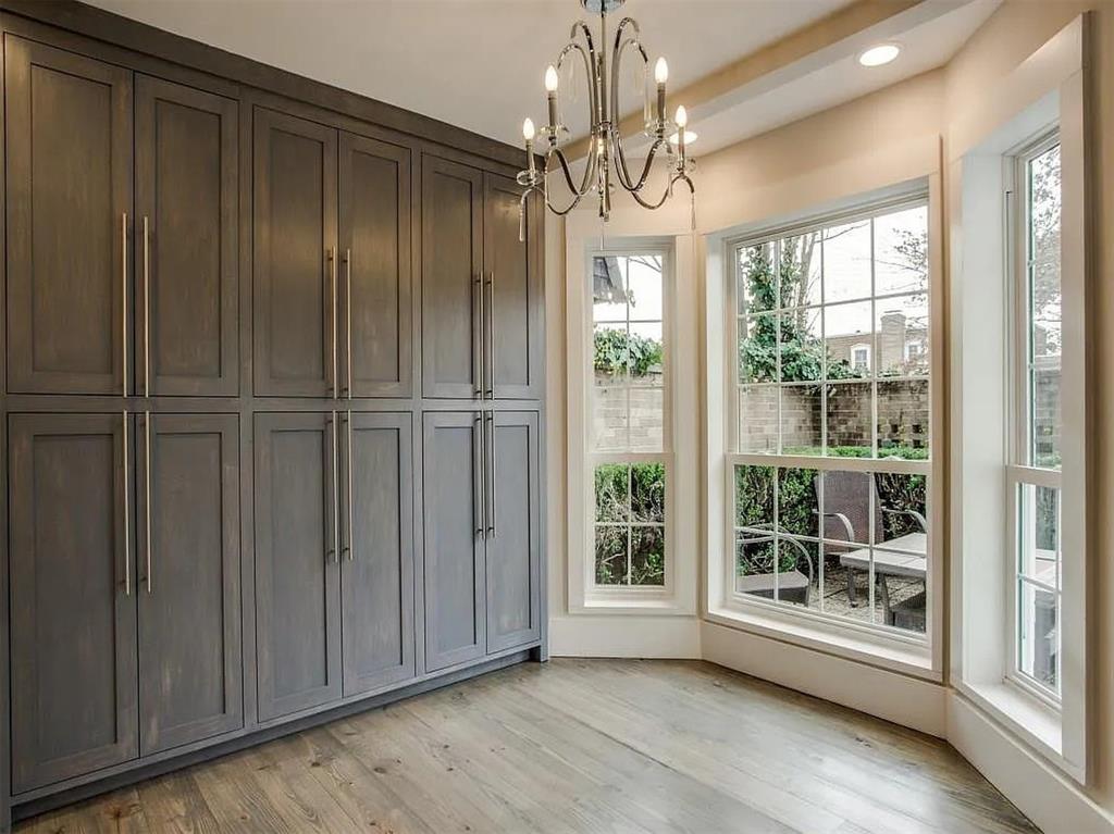 4310 Forest Bend Road Dallas, TX 75244 - Photo 17 of 34 a view of a livingroom with a chandelier wooden floor door and windows