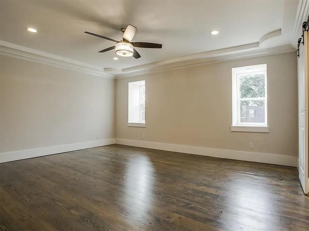 4310 Forest Bend Road Dallas, TX 75244 - Photo 18 of 34 a view of an empty room with wooden floor and a window