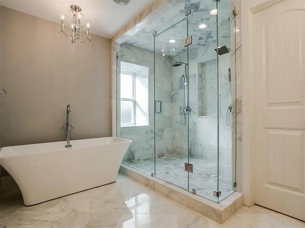 4310 Forest Bend Road Dallas, TX 75244 - Photo 19 of 34 a bathroom with a shower and a sink