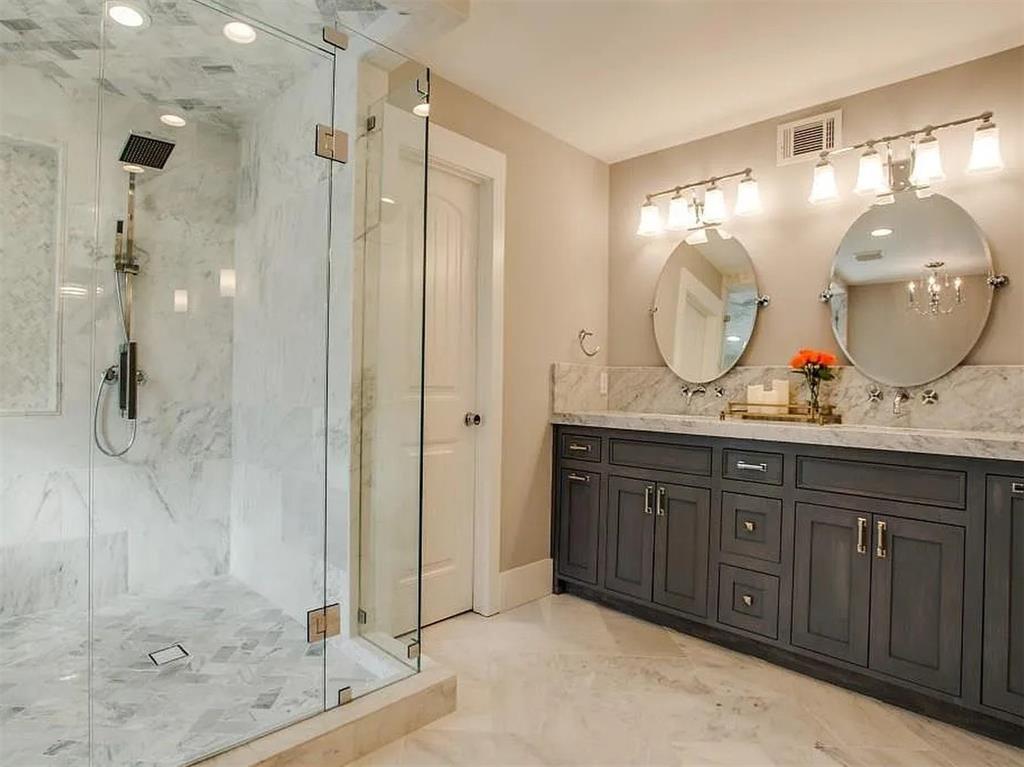 4310 Forest Bend Road Dallas, TX 75244 - Photo 20 of 34 a bathroom with a double vanity sink mirror and shower