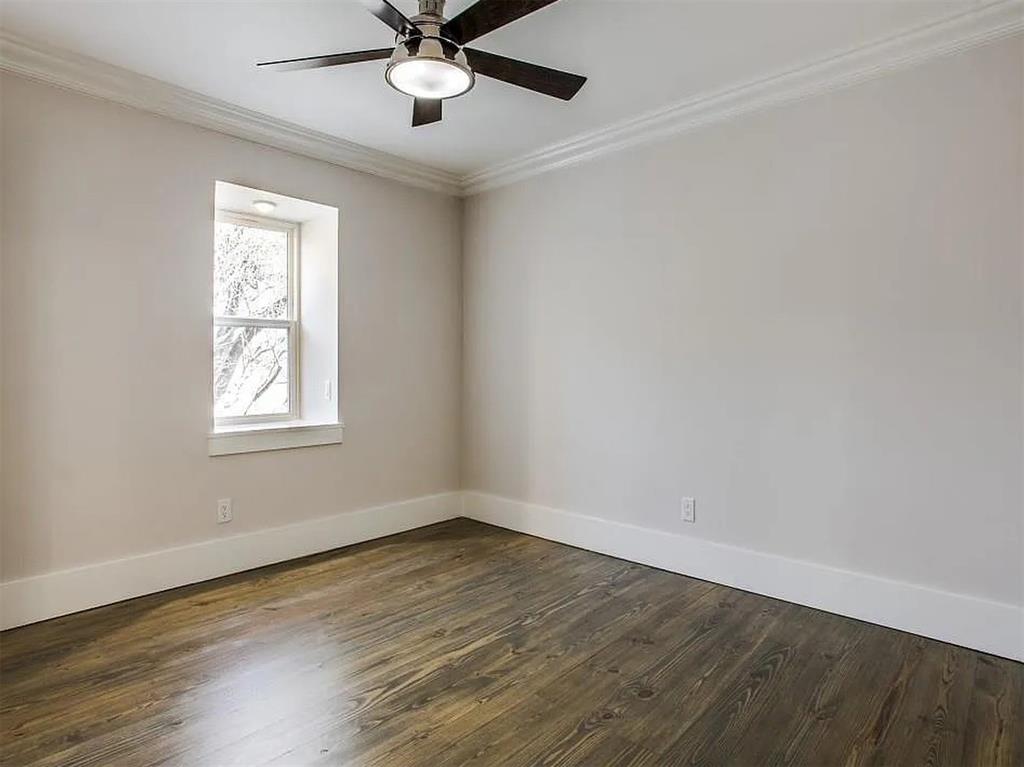 4310 Forest Bend Road Dallas, TX 75244 - Photo 21 of 34 a view of an empty room with wooden floor and a window