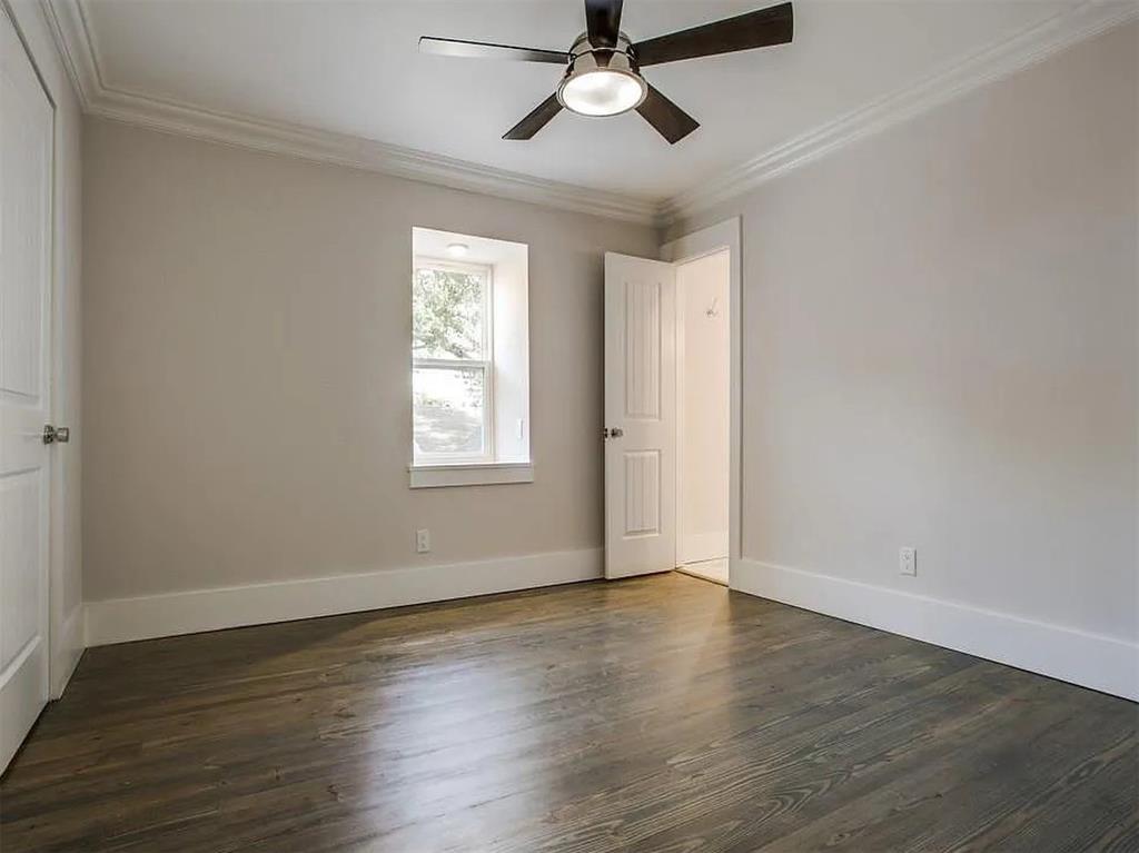4310 Forest Bend Road Dallas, TX 75244 - Photo 22 of 34 a view of an empty room with wooden floor and a window