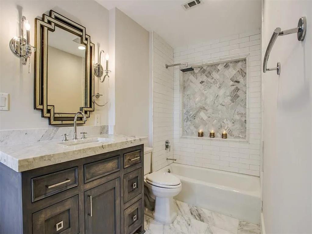 4310 Forest Bend Road Dallas, TX 75244 - Photo 23 of 34 a bathroom with a granite countertop sink toilet and shower