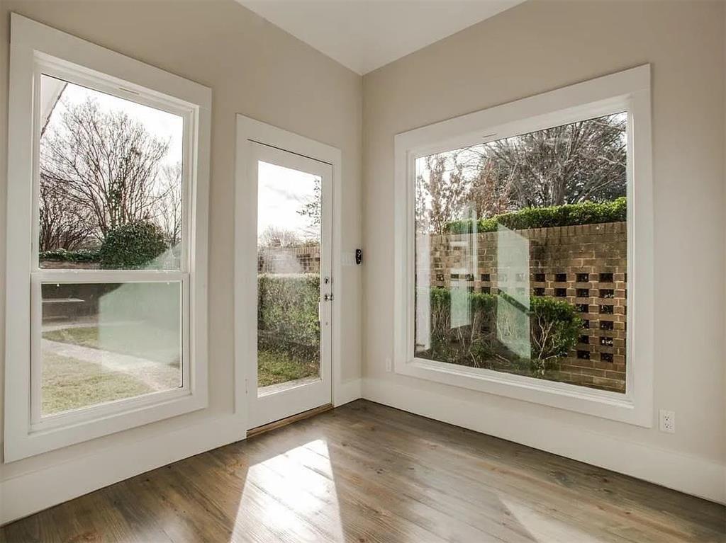 4310 Forest Bend Road Dallas, TX 75244 - Photo 25 of 34 a view of an empty room with wooden floor and a window