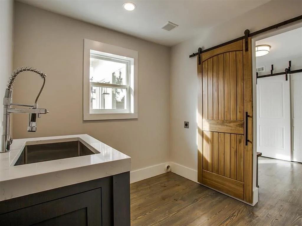 4310 Forest Bend Road Dallas, TX 75244 - Photo 28 of 34 a kitchen with a refrigerator and a sink
