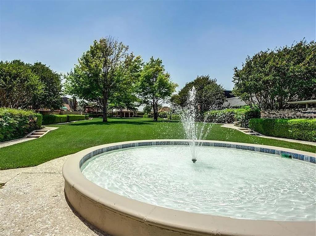 4310 Forest Bend Road Dallas, TX 75244 - Photo 33 of 34 a swimming pool with tall trees in the background