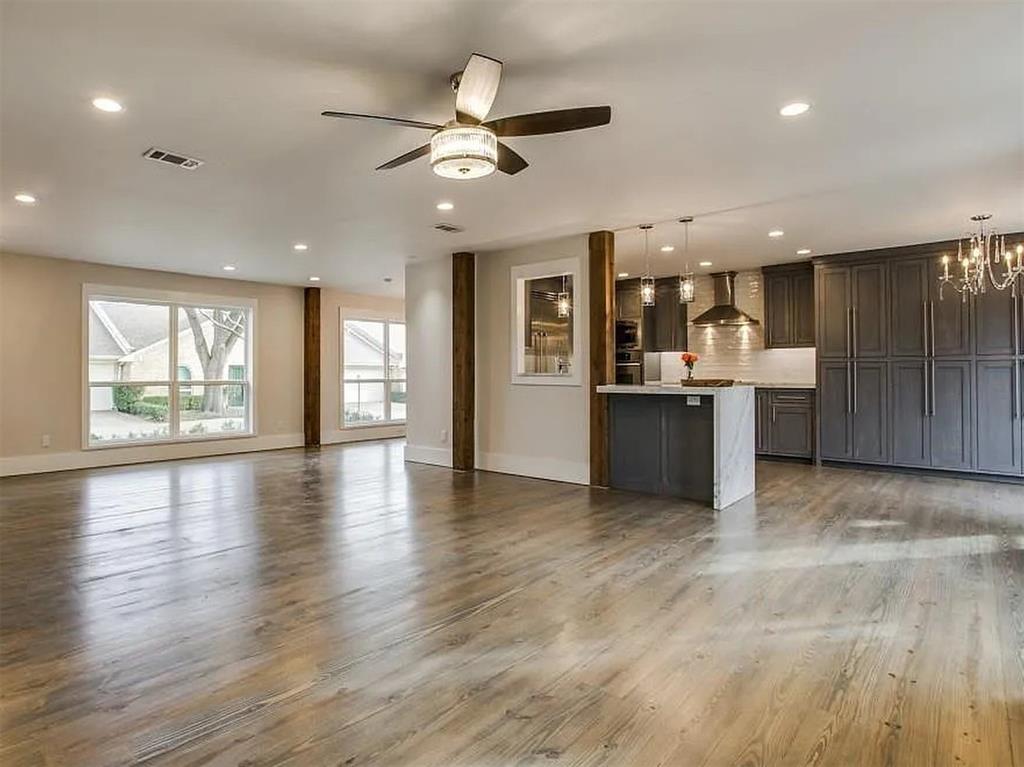 4310 Forest Bend Road Dallas, TX 75244 - Photo 9 of 34 an open kitchen with a refrigerator and microwave