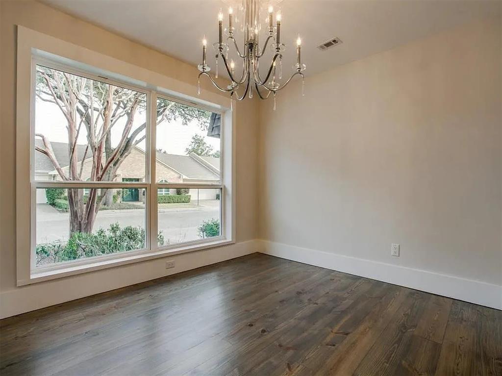 4310 Forest Bend Road Dallas, TX 75244 - Photo 10 of 34 a view of a big room with wooden floor chandelier and windows