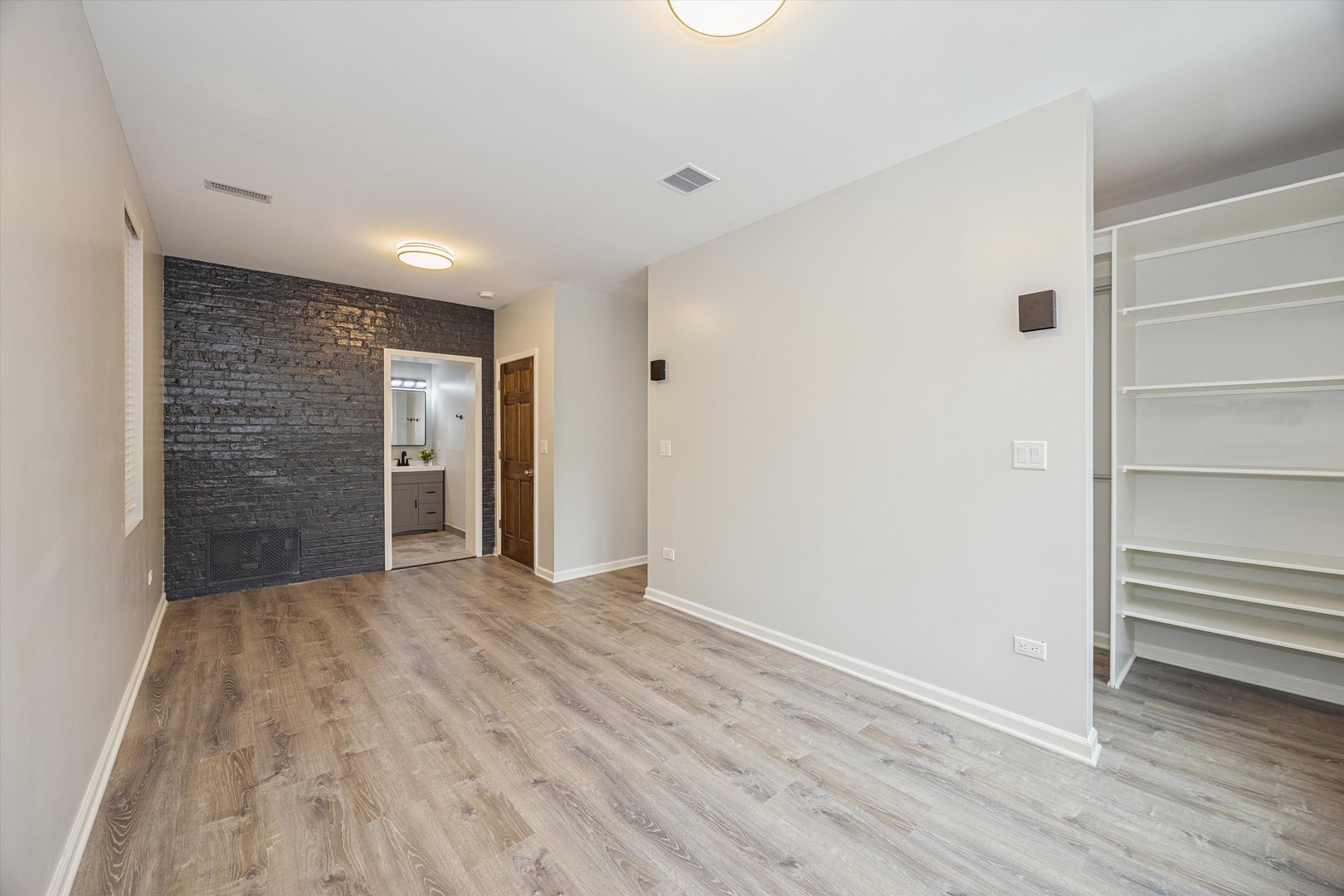 2008 West Addison Street, Unit 2 Chicago, IL 60618 - Photo 15 of 19 a view of an empty room with wooden floor and closet