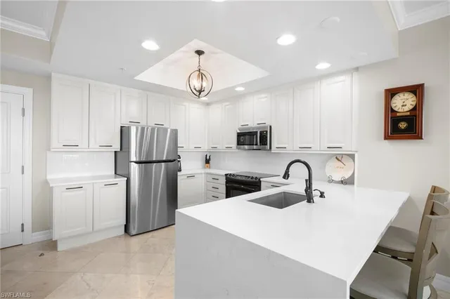 a kitchen with refrigerator and microwave