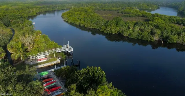an aerial view of a house with a lake view