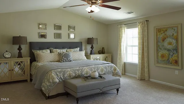 a spacious bedroom with a bed and window