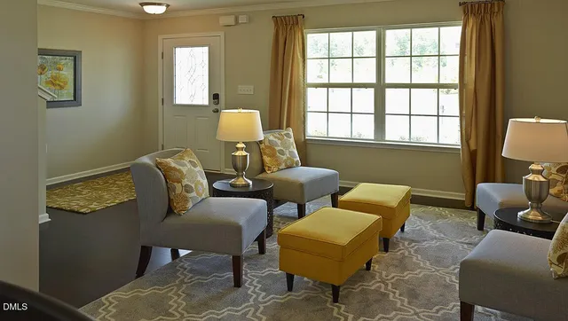 a living room with furniture and a window