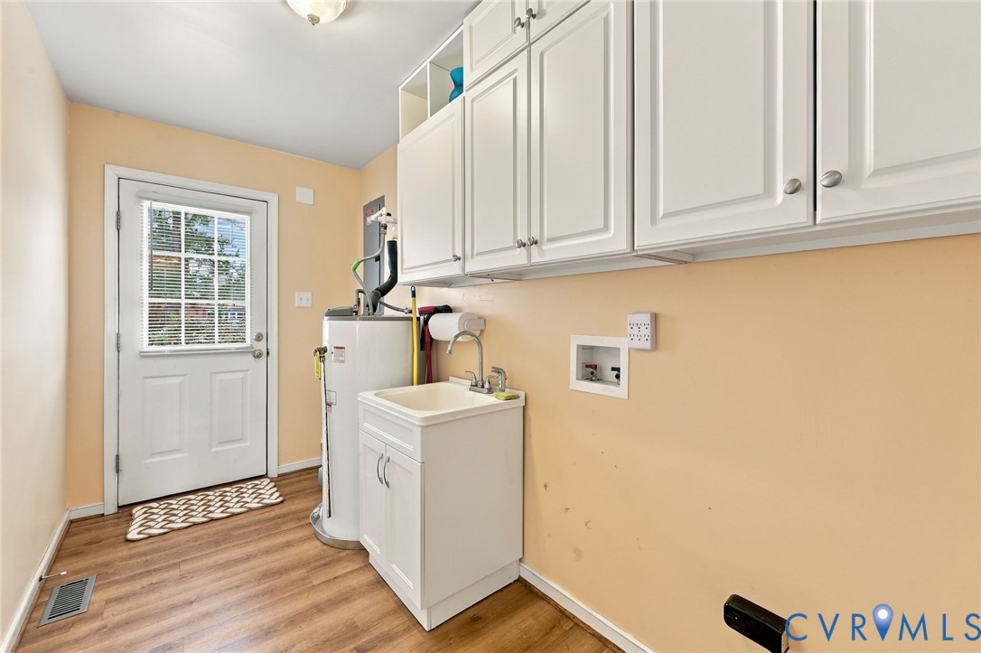 244 East Huntsman Road Sandston, VA 23150 - Photo 31 of 54 White shaker-style cabinetry, wood-finish flooring