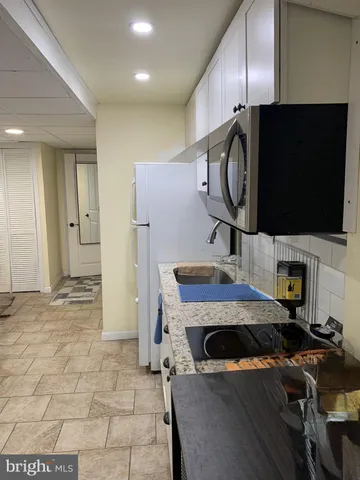 a view of a livingroom with furniture and flat screen tv