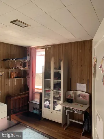 a kitchen with stainless steel appliances wooden cabinets and a stove top oven