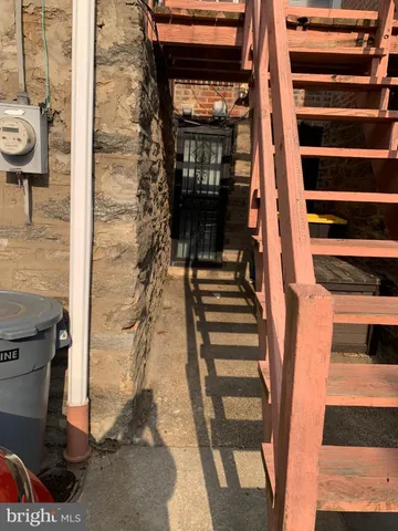 a view of entryway with wooden floor and windows