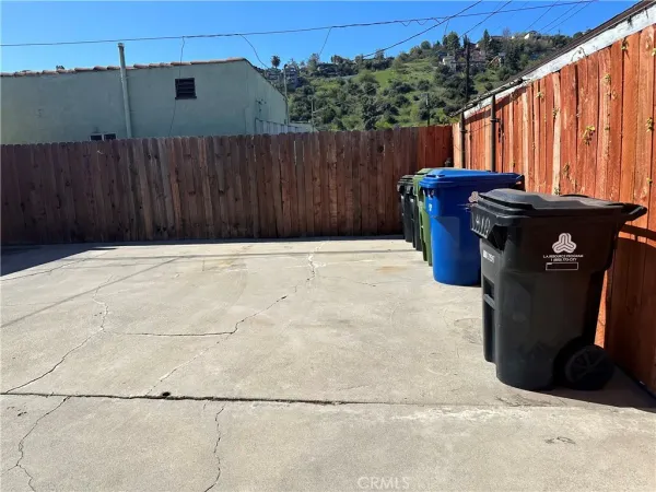 a view of outdoor space with wooden fence