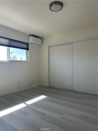 an empty room with a empty space and windows