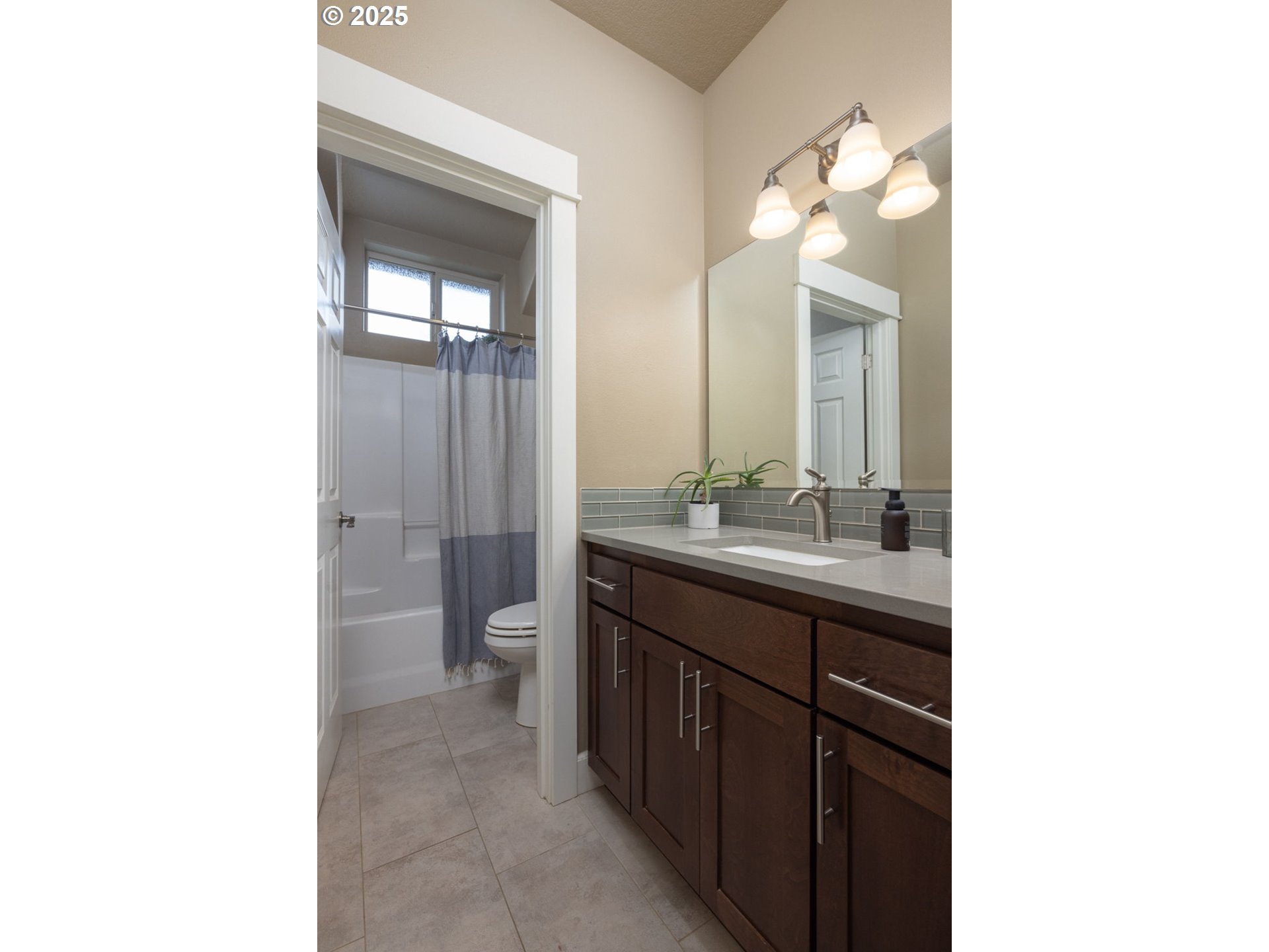 62905 Daniel Road Bend, OR 97701 - Photo 14 of 28 a bathroom with a sink a toilet and shower