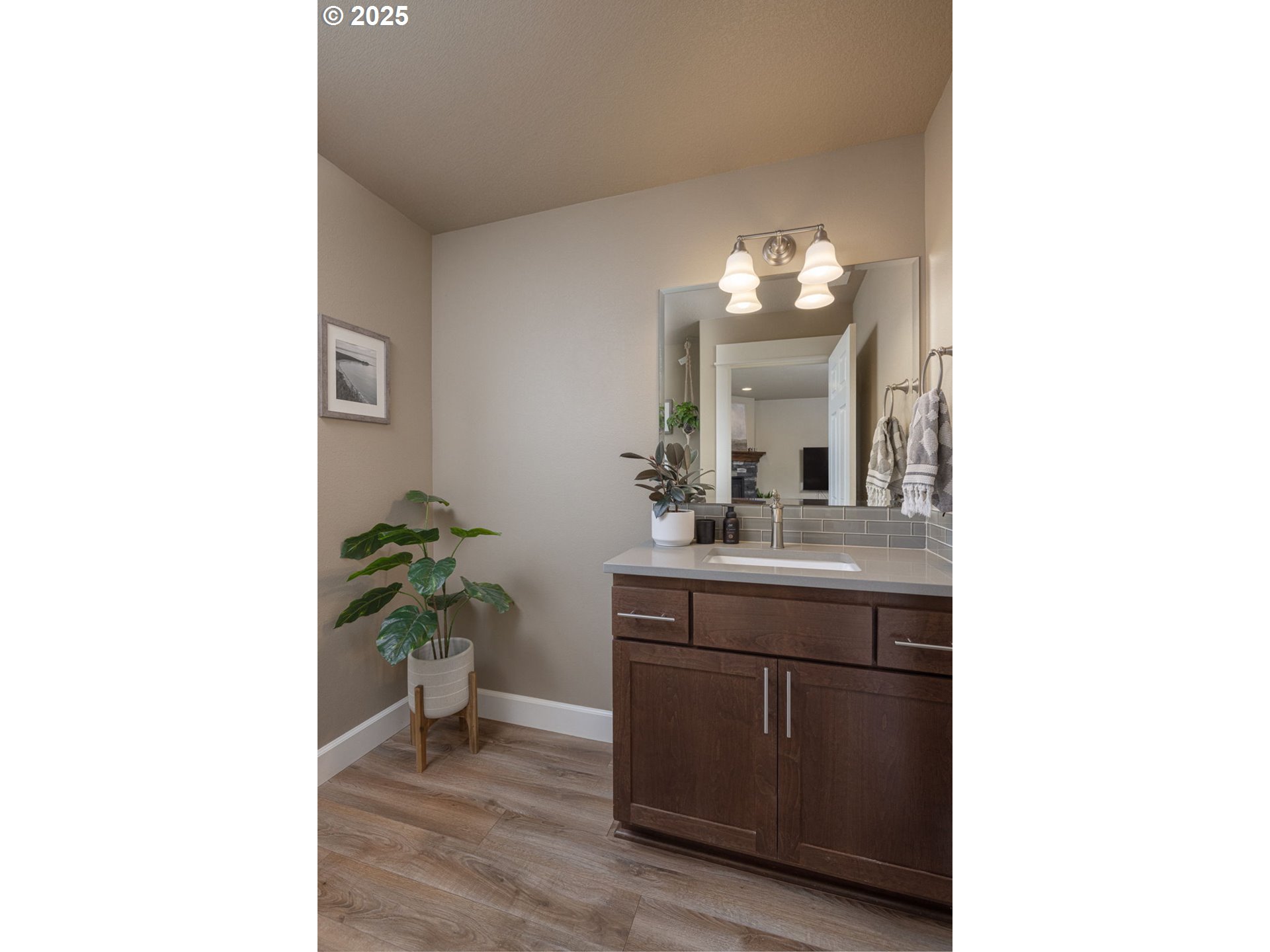 62905 Daniel Road Bend, OR 97701 - Photo 15 of 28 a room with a sink and a mirror