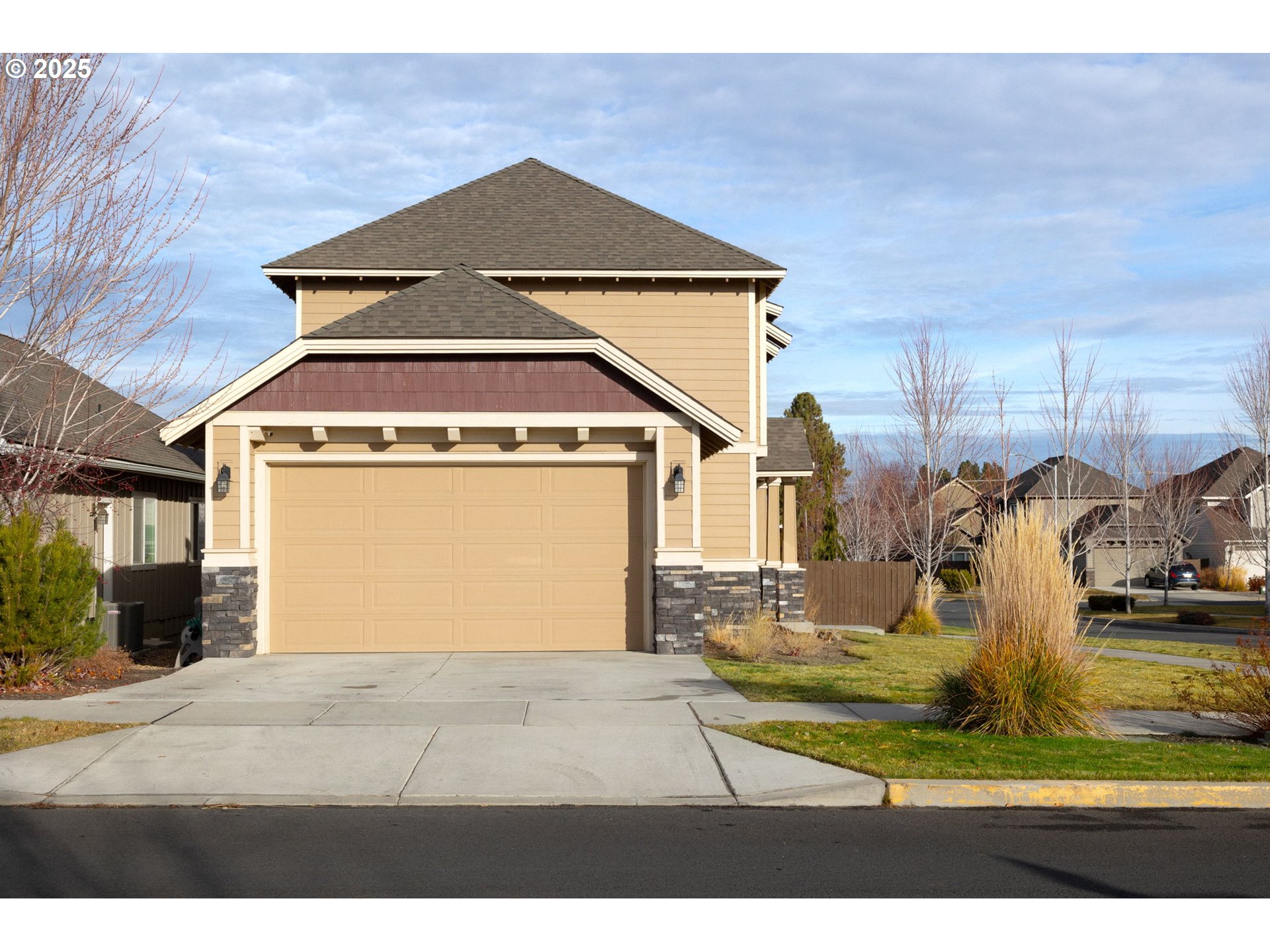 62905 Daniel Road Bend, OR 97701 - Photo 22 of 28 a view of a house with a yard