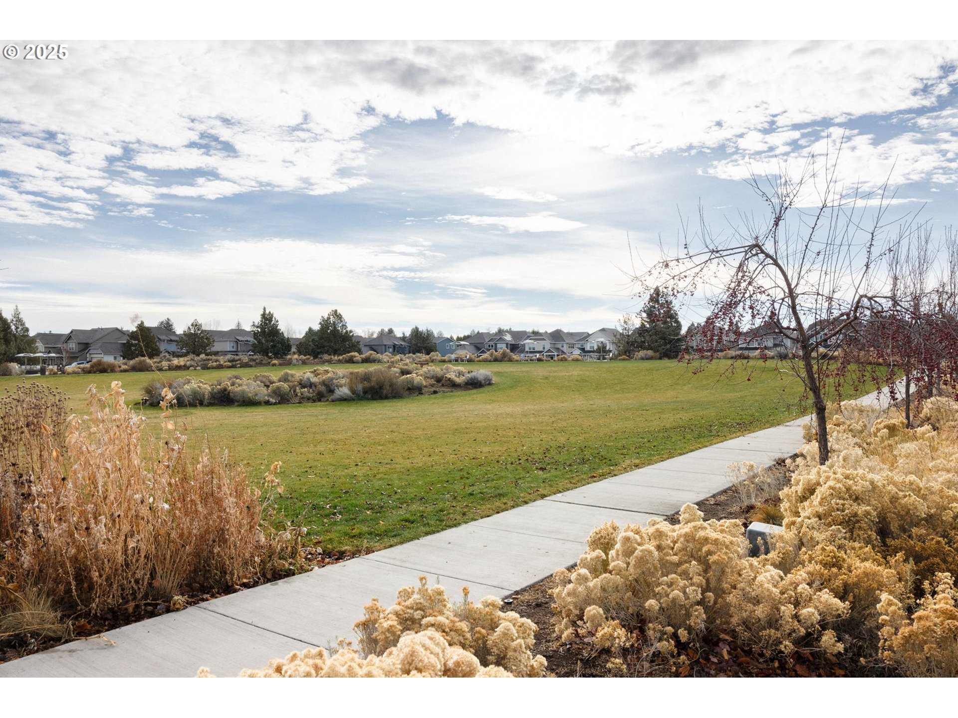 62905 Daniel Road Bend, OR 97701 - Photo 26 of 28 a view of a lake with a yard