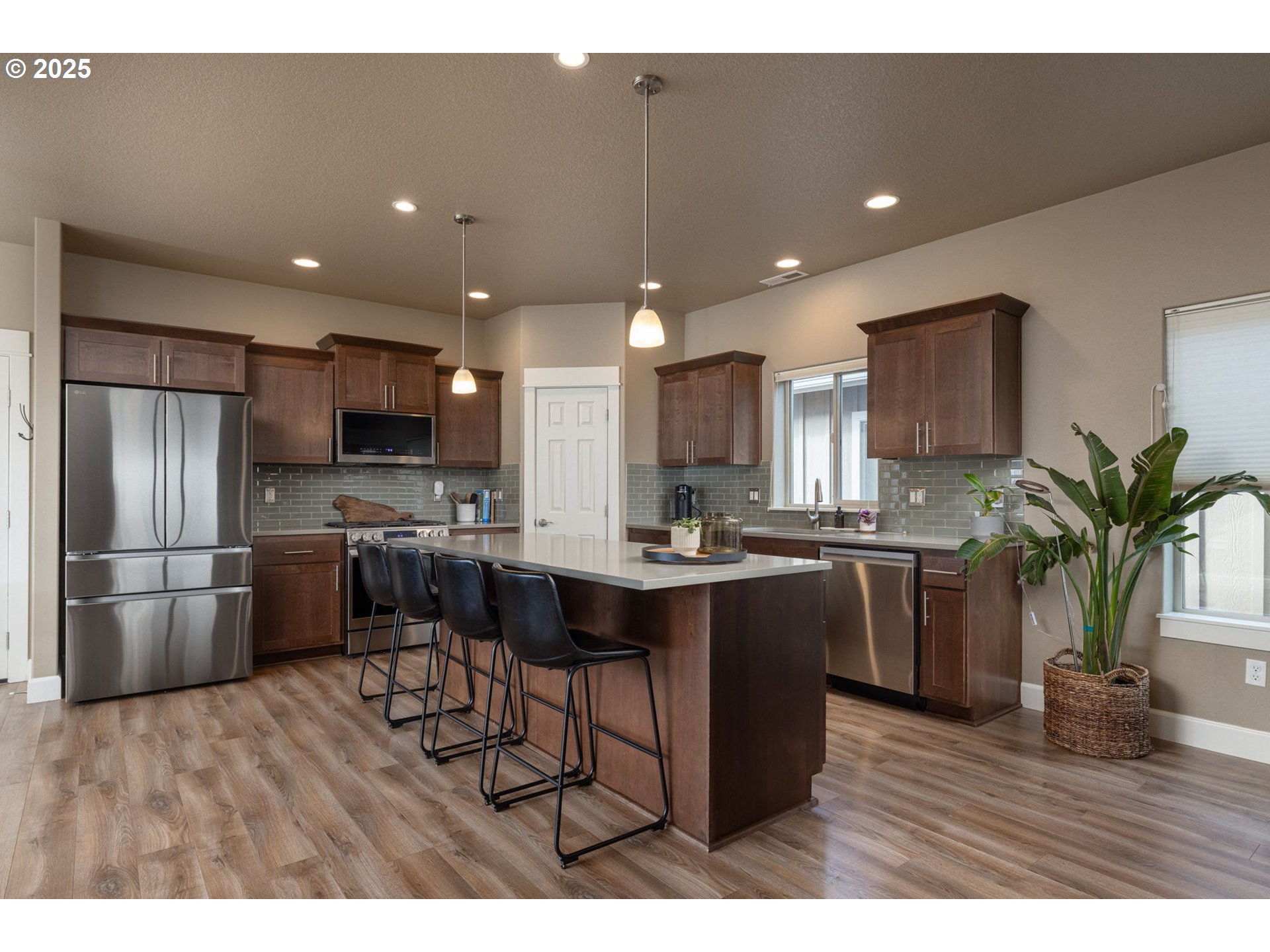 62905 Daniel Road Bend, OR 97701 - Photo 5 of 28 a kitchen with a sink appliances and cabinets