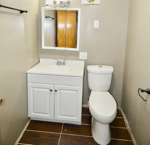 a bathroom with a toilet and a sink
