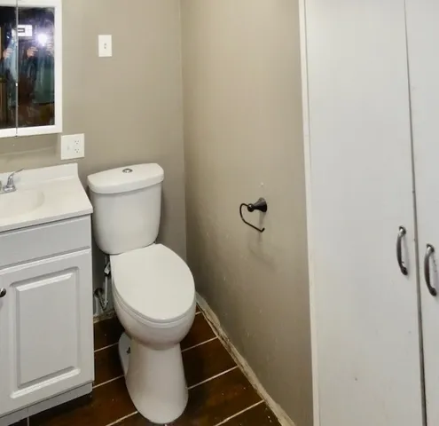 a bathroom with a toilet and a sink