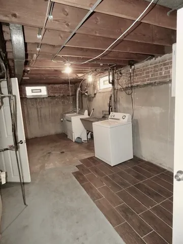 a room with water heater and white walls