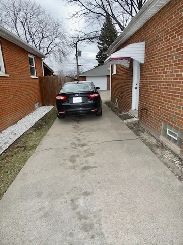 a car parked in front of a house