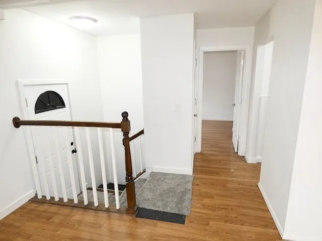 a view of entryway with wooden floor