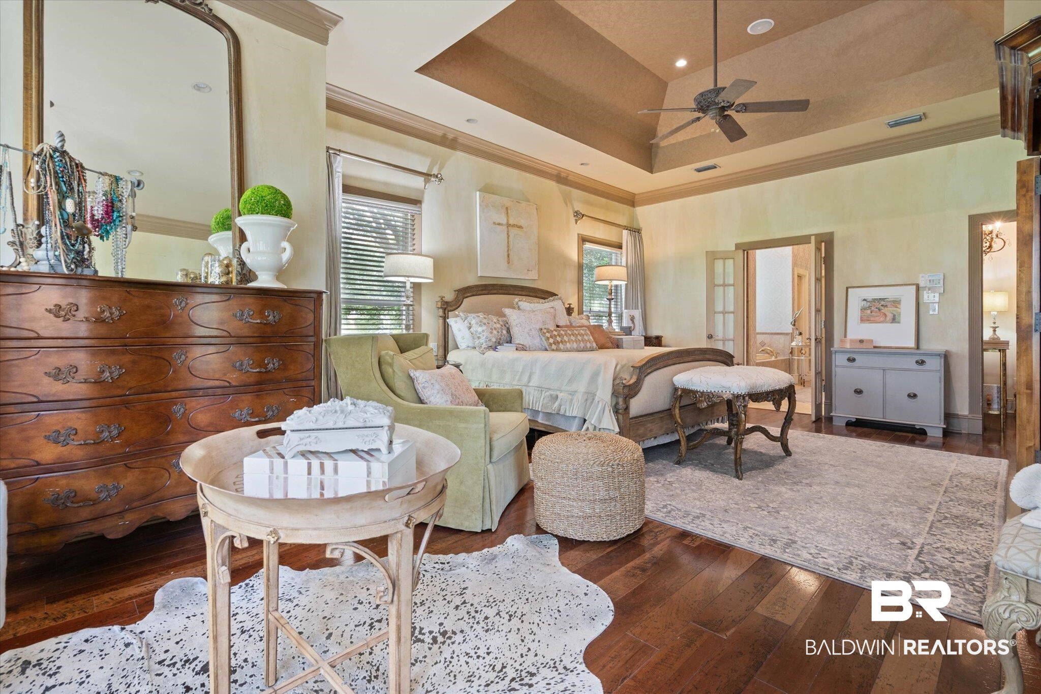 2905 Riverview Pointe Drive South Theodore, AL 36582 - Photo 14 of 44 Bedroom with crown molding, dark wood-type flooring, a raised ceiling, and a ceiling fan