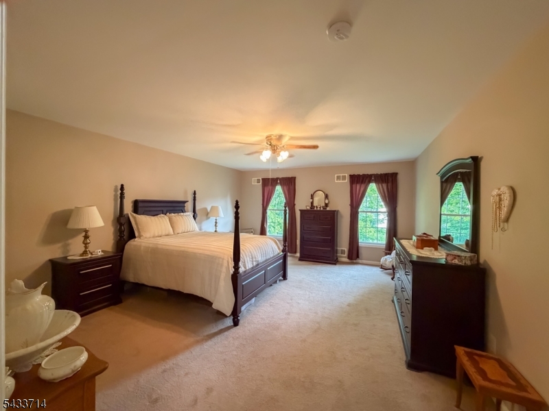 29 Lark Lane Oak Ridge, NJ 07438 - Photo 14 of 26 a spacious bedroom with a bed and window