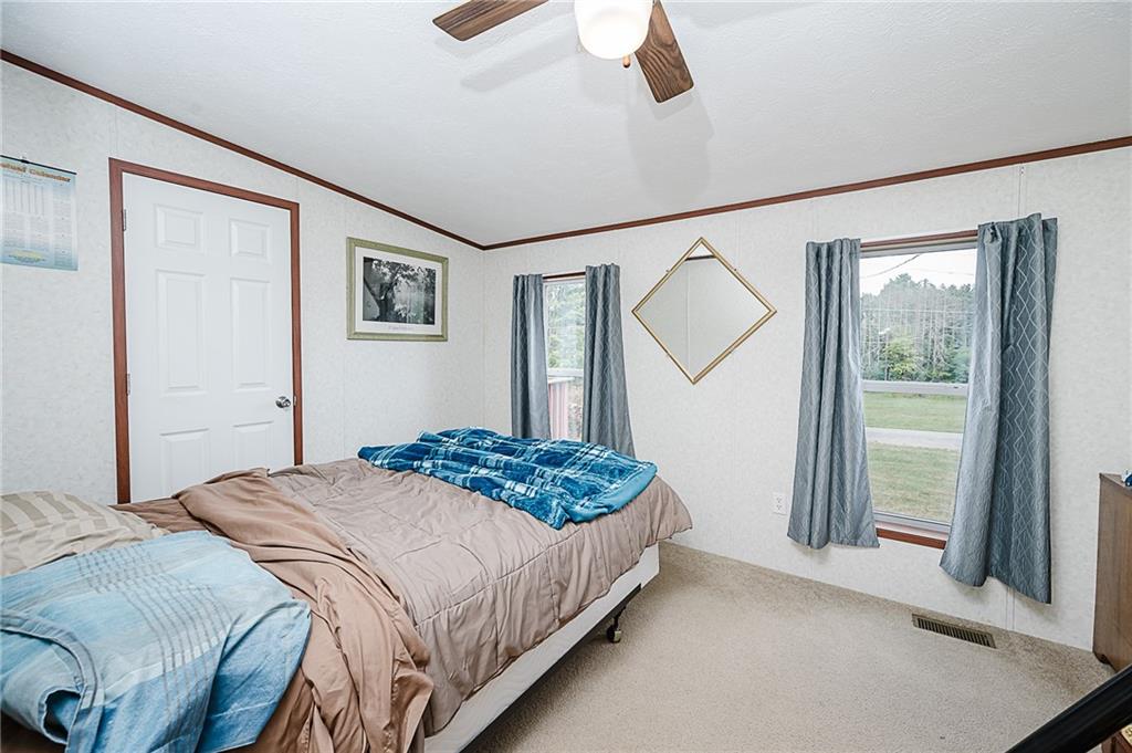1171 Churchill Road Marion Center, PA 15759 - Photo 11 of 28 a bedroom with a bed and a large mirror