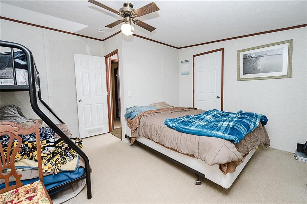 1171 Churchill Road Marion Center, PA 15759 - Photo 12 of 28 a bedroom with a bed couch and window