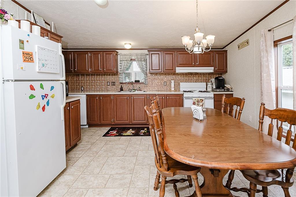 1171 Churchill Road Marion Center, PA 15759 - Photo 14 of 28 a dining table chair in a kitchen with breakfast area
