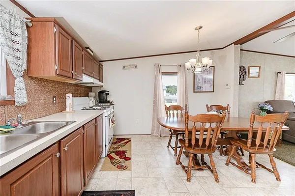 a view of kitchen and dining area with furniture