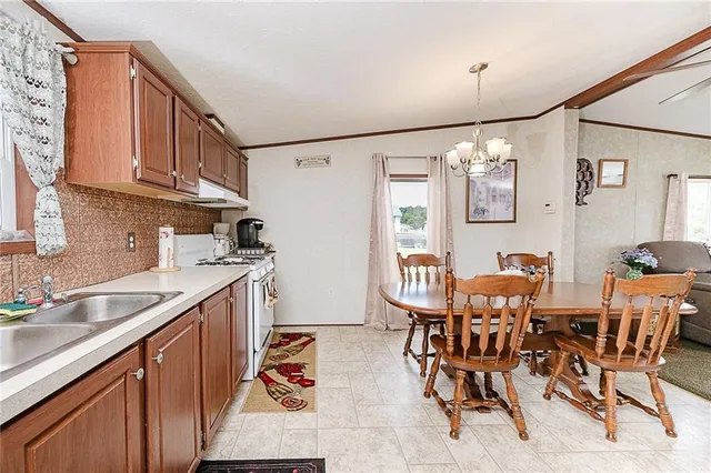a view of kitchen and dining area with furniture
