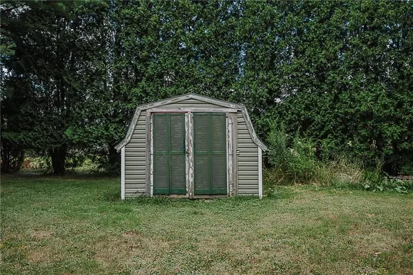 a view of a field with a trees